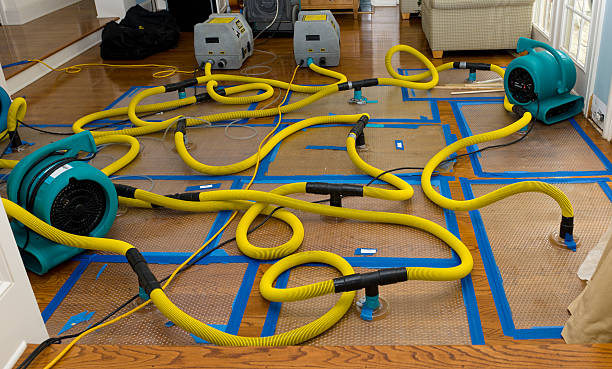 Professional Flood Damage Restoration technician working in Pewaukee, WI